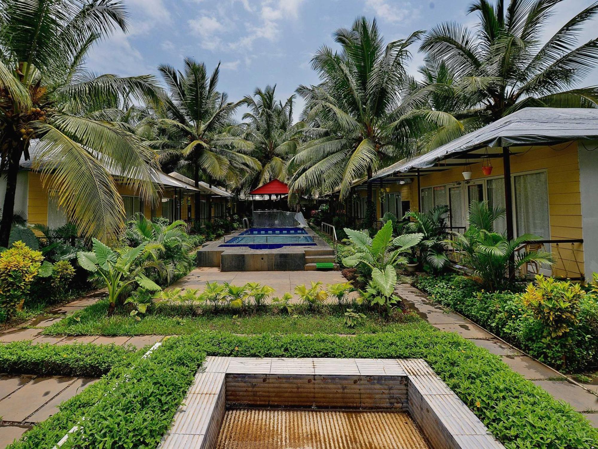 Collection O Retreat Morjim Resort Bagian luar foto