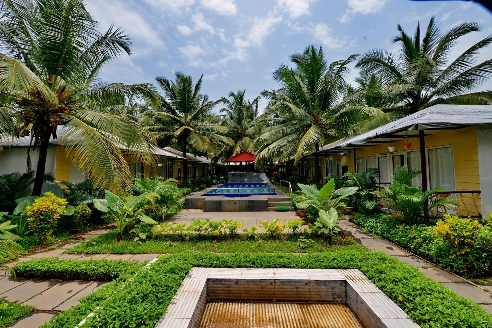Collection O Retreat Morjim Resort Bagian luar foto
